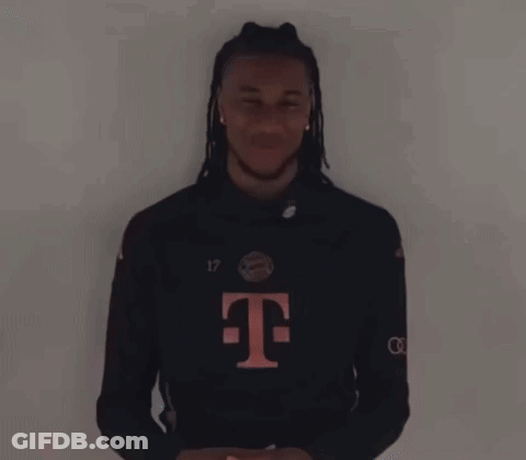 A Man With Dreadlocks And A T-Mobile Shirt Is Laughing GIF