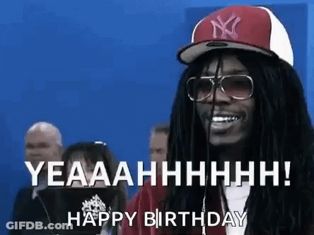 A Man With Dreadlocks And Glasses Is Wearing A Hat And Sunglasses And Saying Happy Birthday . GIF