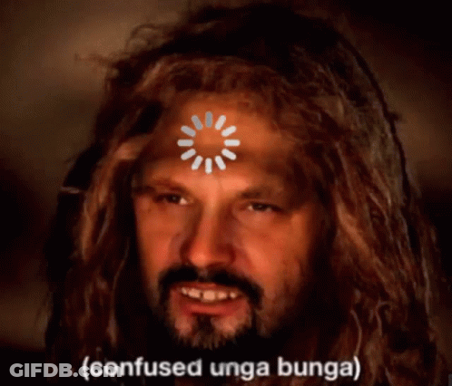 A Man With Dreadlocks Has A Loading Circle On His Forehead And The Words Confused Unga Bunga On The Bottom GIF