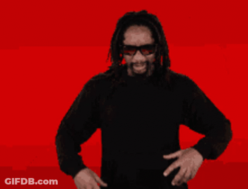 A Man With Dreadlocks Has The Word Ok In Front Of His Mouth GIF