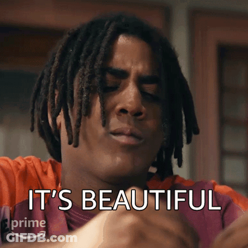 A Man With Dreadlocks Has The Words " It 'S Beautiful " Written On His Face GIF