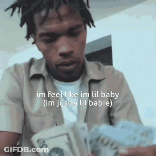 A Man With Dreadlocks Is Holding A Bunch Of Money And Says Im Feel Like Im Lil Baby GIF