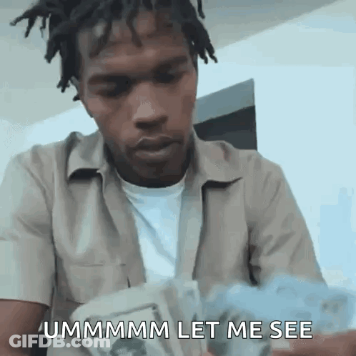 A Man With Dreadlocks Is Holding A Bunch Of Money And Says `` Ummmmm Let Me See '' . GIF