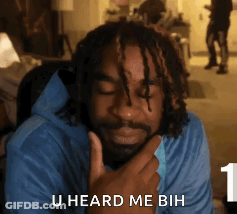 A Man With Dreadlocks Is Holding His Hand To His Chin And Says U Heard Me Buh . GIF