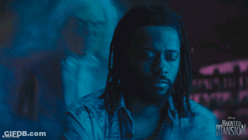A Man With Dreadlocks Is In A Haunted Mansion Advertisement GIF