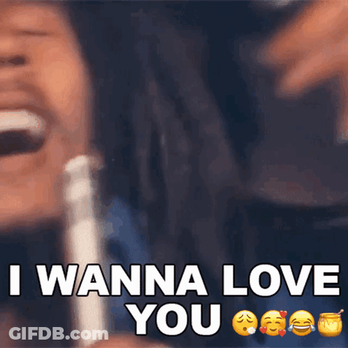A Man With Dreadlocks Is Laughing With The Words I Wanna Love You GIF