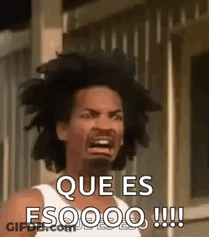 A Man With Dreadlocks Is Making A Funny Face And Says `` Que Es Esoooo !!! '' . GIF