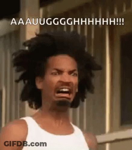 A Man With Dreadlocks Is Making A Funny Face With His Mouth Open . GIF
