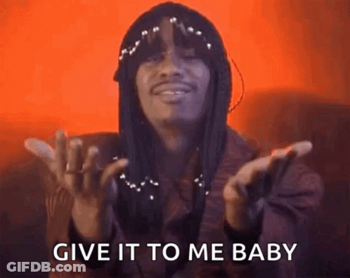 A Man With Dreadlocks Is Making A Gesture With His Hands And Saying `` Give It To Me Baby '' . GIF
