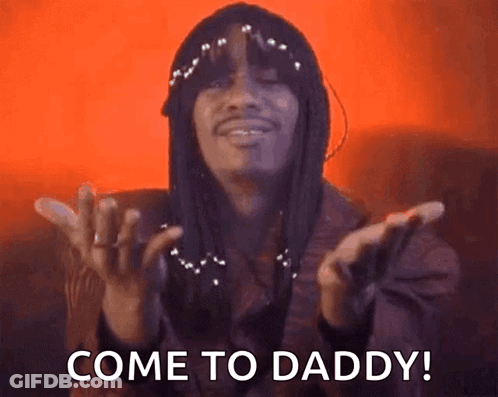 A Man With Dreadlocks Is Saying Come To Daddy With His Hands Outstretched . GIF