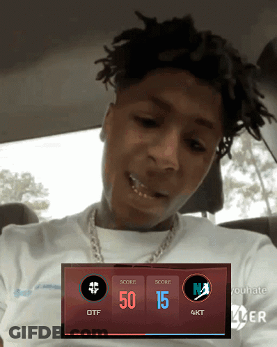 A Man With Dreadlocks Is Sitting In A Car With A Scoreboard Displaying 50 15 And 4Kt GIF