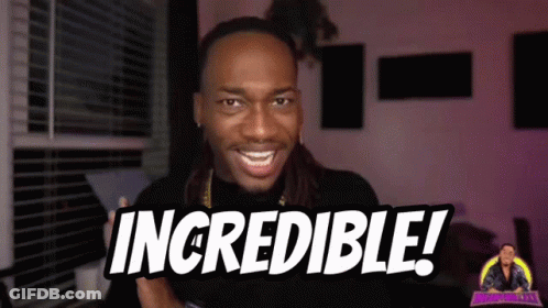 A Man With Dreadlocks Is Smiling And Holding A Sign That Says Incredible GIF