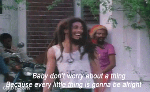 A Man With Dreadlocks Is Standing In Front Of A Motorcycle With The Words Baby Don T Worry GIF