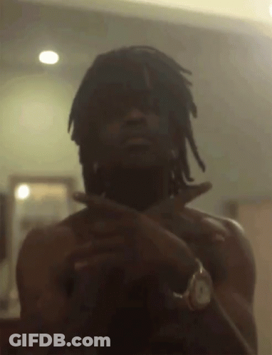 A Man With Dreadlocks Is Taking A Picture Of Himself GIF