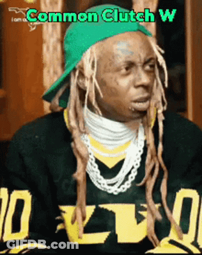 A Man With Dreadlocks Is Wearing A Green Hat And A Sweater That Says I Am A Common Clutch W. GIF