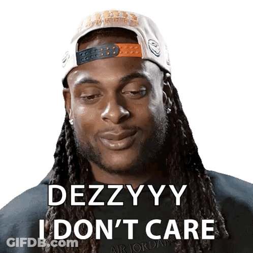 A Man With Dreadlocks Is Wearing A Hat And Says Dezzyyy I Don 'T Care GIF