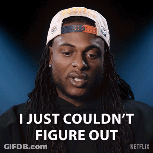 A Man With Dreadlocks Is Wearing A Hat That Says I Just Couldn 'T Figure Out GIF