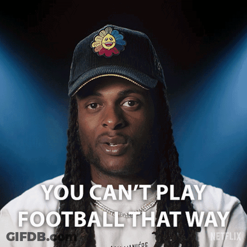A Man With Dreadlocks Is Wearing A Hat That Says You Can 'T Play Football That Way GIF