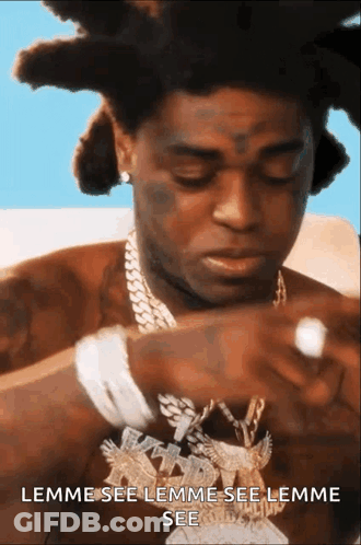 A Man With Dreadlocks Is Wearing A Necklace That Says Lemme See Lemme See Lemme See .. GIF