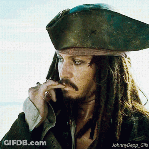 A Man With Dreadlocks Is Wearing A Pirate Hat And Smoking A Cigar GIF