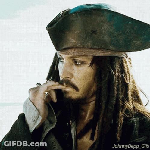 A Man With Dreadlocks Is Wearing A Pirate Hat And Smoking A Cigar GIF