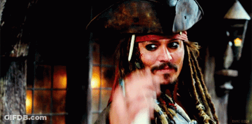 A Man With Dreadlocks Is Wearing A Pirate Hat And Waving His Hand GIF
