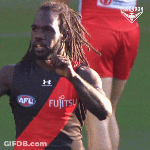 A Man With Dreadlocks Is Wearing A Shirt That Says Fujitsu On It GIF