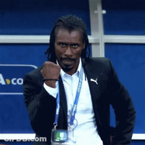 A Man With Dreadlocks Is Wearing A Suit And A Lanyard That Says World Cup Russia . GIF