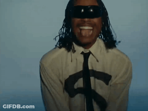 A Man With Dreadlocks Is Wearing A White Shirt And Tie And Sunglasses . GIF