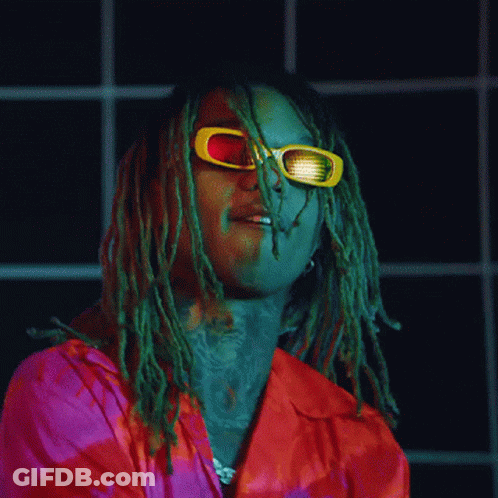 A Man With Dreadlocks Is Wearing Sunglasses And A Red Shirt GIF