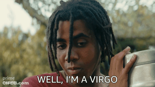 A Man With Dreadlocks Says Well I 'M A Virgo While Holding Something GIF