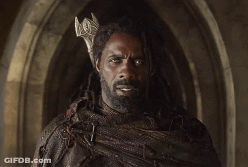 A Man With Dreadlocks Wearing A Crown On His Head GIF