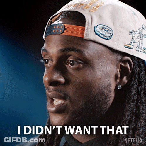 A Man With Dreadlocks Wearing A Hat That Says I Did N't Want That On It GIF