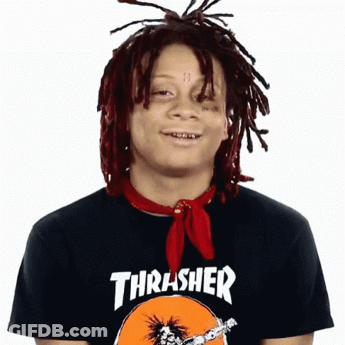 A Man With Dreadlocks Wearing A Thrasher Shirt GIF