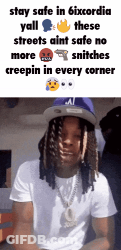 A Man With Dreadlocks Wearing A White Shirt And A Blue Hat Says Stay Safe In 6Ixcordia GIF