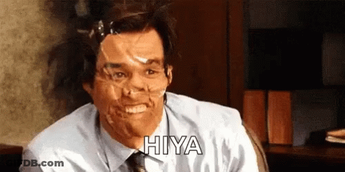 A Man With Duct Tape On His Face Is Smiling And Says Hiya GIF