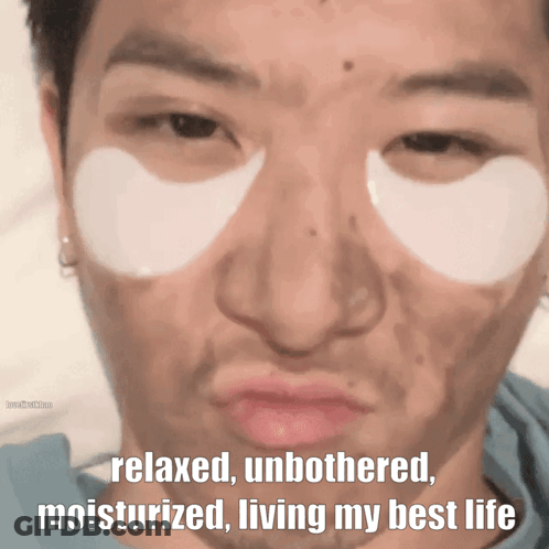 A Man With Eye Patches On His Face Has The Words Relaxed Unbothered Moisturized Living My Best Life Below His Face GIF