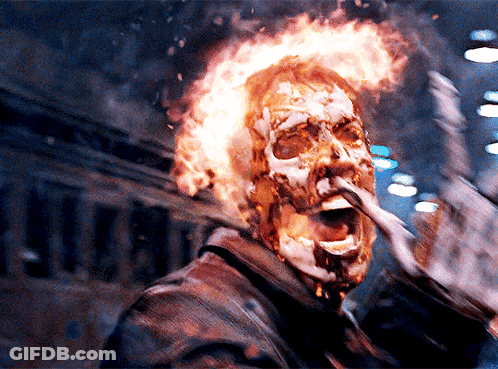 A Man With Flames Coming Out Of His Head Is Making A Funny Face GIF