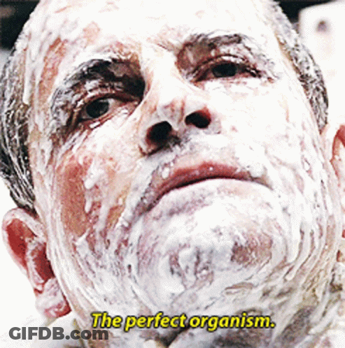 A Man With Foam On His Face And The Words " The Perfect Organism " Above Him GIF