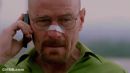 A Man With Glasses And A Bandage On His Nose Talks On A Cell Phone GIF