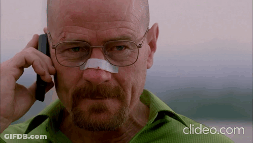 A Man With Glasses And A Bandage On His Nose Talks On A Cell Phone GIF