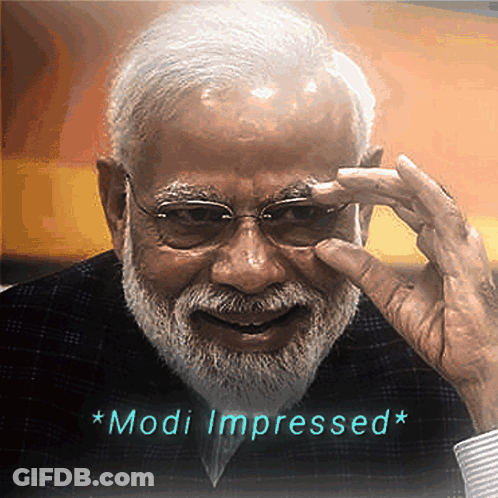 A Man With Glasses And A Beard Has The Words Modi Impressed Written Below Him GIF
