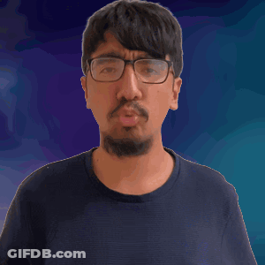 A Man With Glasses And A Beard Holds His Finger To His Lips GIF