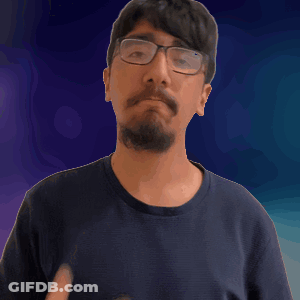A Man With Glasses And A Beard Holds His Hand To His Heart GIF