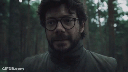 A Man With Glasses And A Beard In A Forest GIF