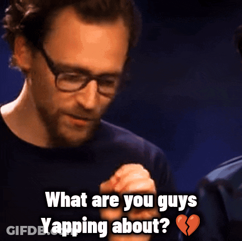 A Man With Glasses And A Beard Is Asking What Are You Guys Yapping About GIF