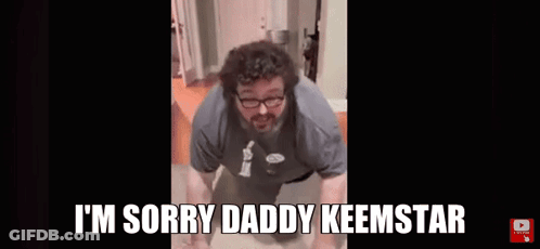 A Man With Glasses And A Beard Is Doing Push Ups In A Bathroom . GIF