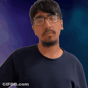 A Man With Glasses And A Beard Is Giving A Thumbs Down Sign GIF