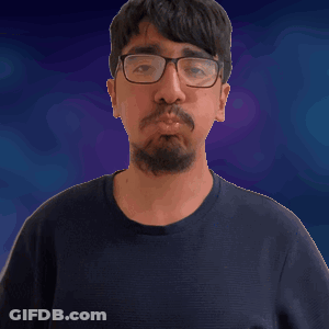 A Man With Glasses And A Beard Is Giving A Thumbs Up Sign GIF