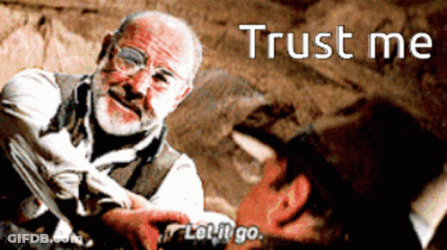A Man With Glasses And A Beard Is Holding Another Man 'S Hand And Says " Trust Me " GIF